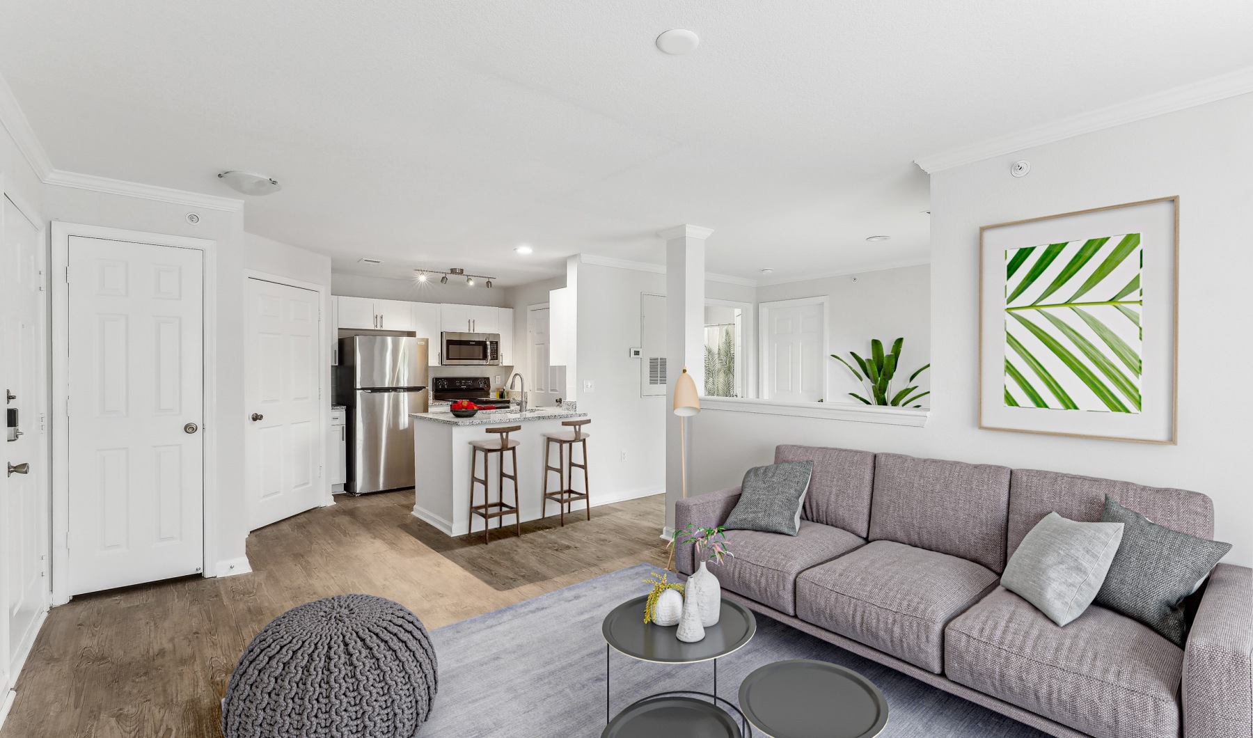 Spaciously designed to meet your needs and expectations open floor plan with eat in kitchen, couch & decor